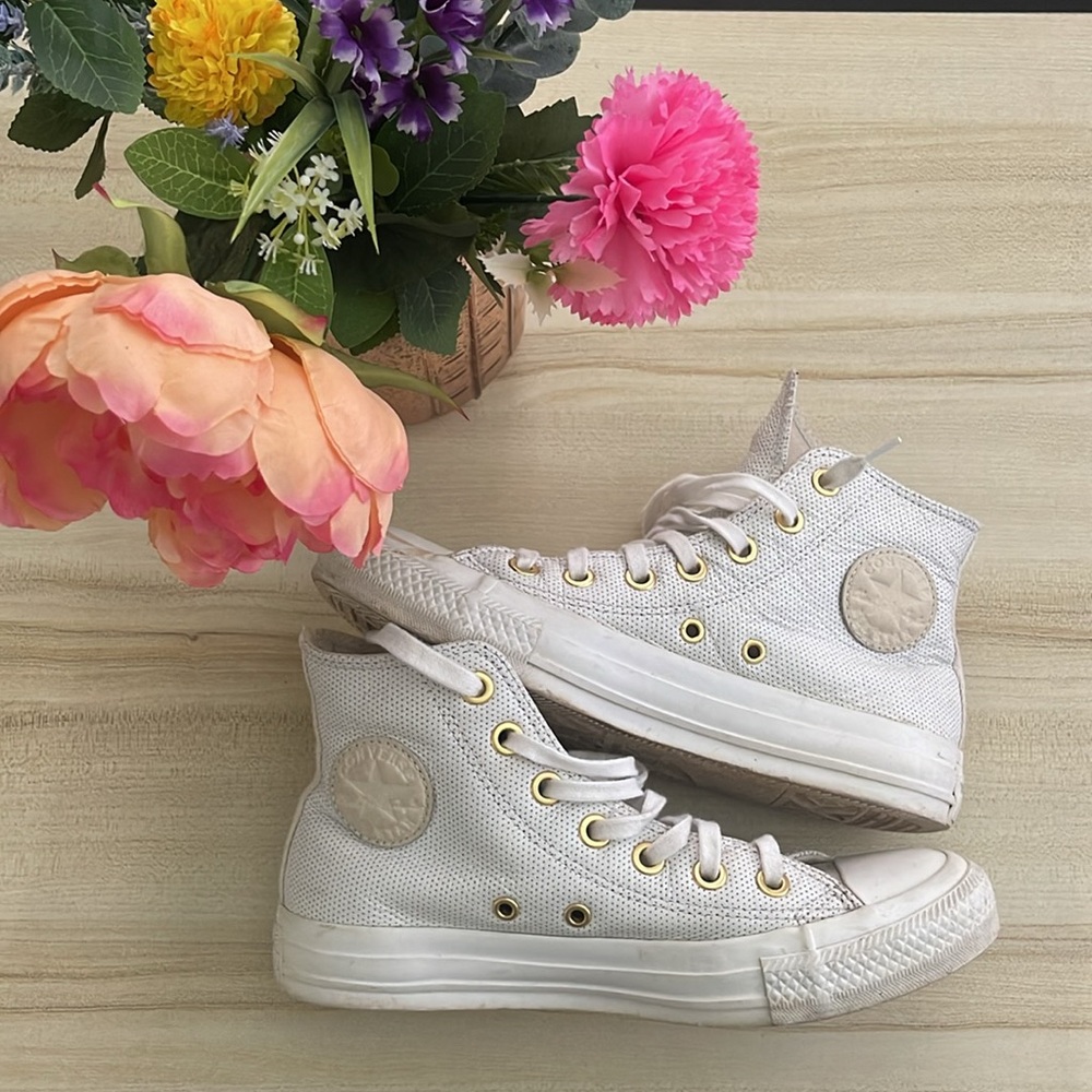 White and gold leather converse
